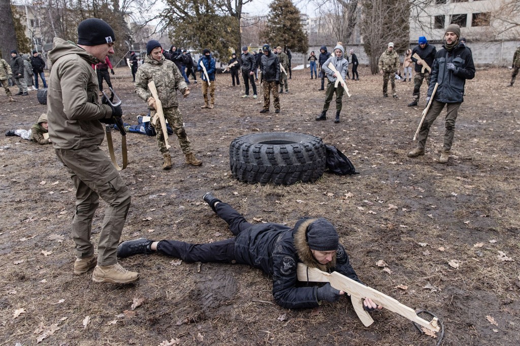 Civilians participate in a military training course