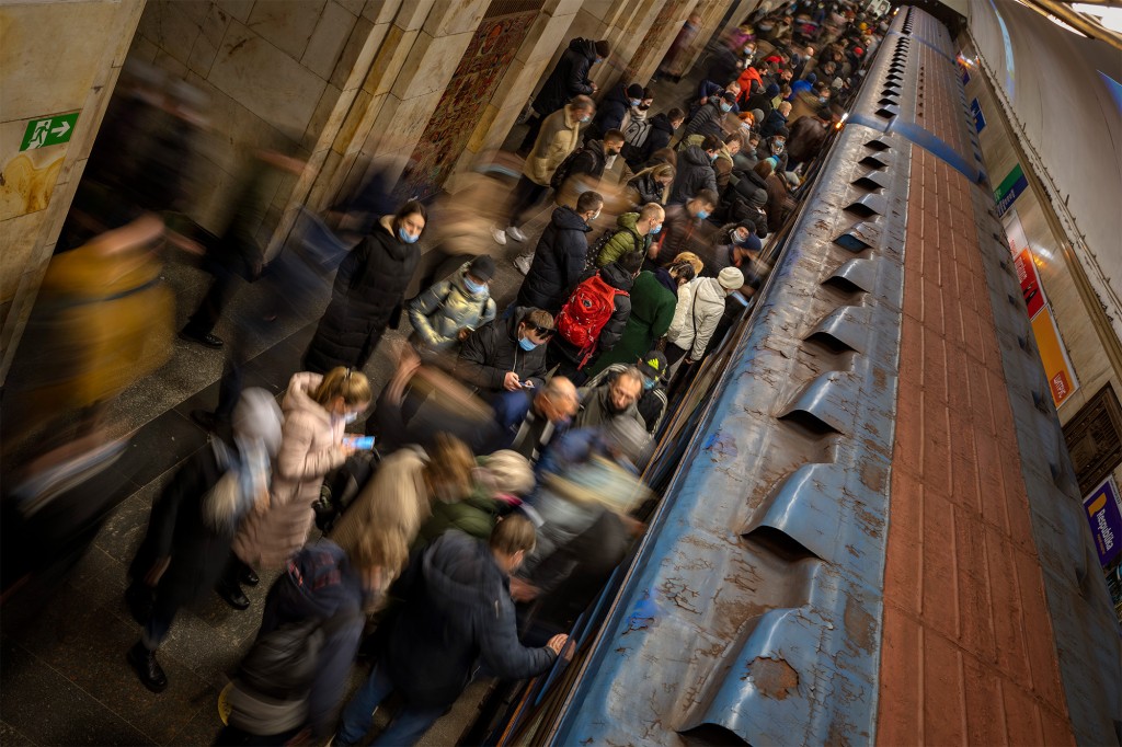 Passengers wait for a train at the Kiev subway station on February 23, 2022.