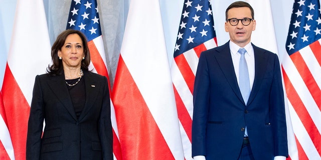 Polish Prime Minister Mateusz Morawiecki, right, and US Vice President Kamala Harris are pictured as they arrive for a meeting, in Warsaw, Poland, Thursday, March 10, 2022.
