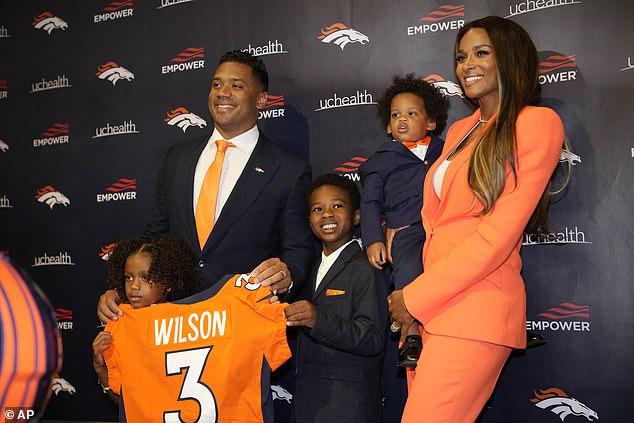 Beaming: Ciara and Russel Wilson looked like a happy family as their children joined them at the Denver Broncos headquarters in Englewood, Colorado, on Wednesday