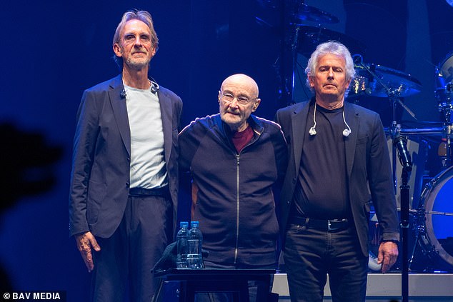 Applause: Phil Collins bid an emotional farewell to Genesis fans along with bandmates Mike Rutherford (left) and Tony Banks (right) in London on Saturday - where the popular band held their last-ever concert.