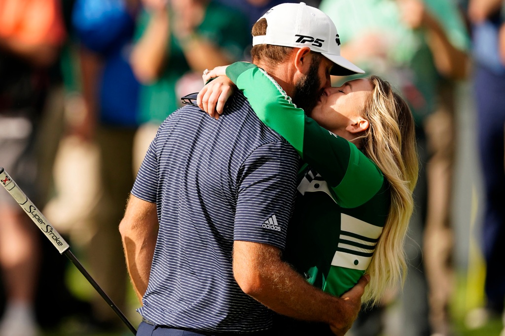 Johnson and Gretzky kiss after the golfer won the Masters 2020