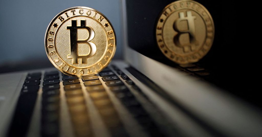 Bitcoin drops to 22-month low as stock markets falter
