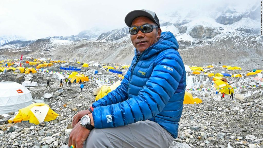 A Nepalese official says the Sherpa has once again broken his record by climbing Everest 26 times