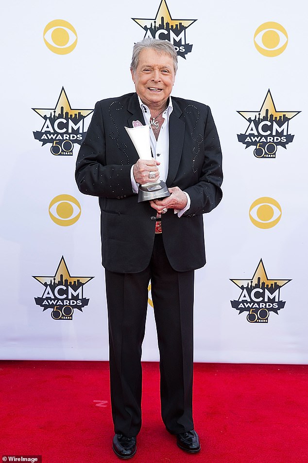 Music legend: Mickey Gilly, the country music singer who made a string of blockbuster hits in the '70s and '80s, has died at the age of 86;  seen in 2015