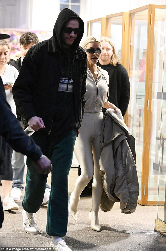 Chic: While Pete cut a casual figure in a green tracksuit, he wore a black graphic T-shirt, which he wore under a black hoodie.