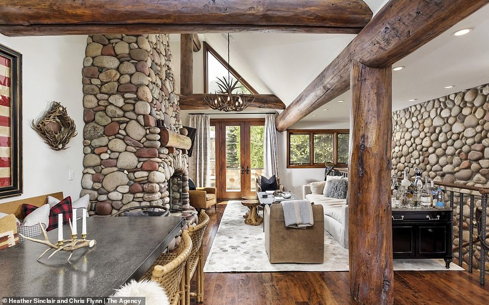 Living in the cabin!  Kyle Richards and husband Mauricio Umansky put the stunning Aspen haven on the market for $9.75 million