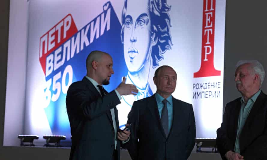 President Vladimir Putin, center, at an exhibition commemorating the 350th anniversary of the birth of Russia's first emperor, Peter the Great, in Moscow
