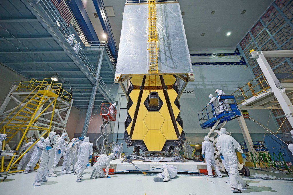 What looks like a science fiction teleporter being positioned atop NASA's James Webb Space Telescope, is actually "Clean tent." The