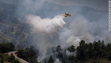Portugal suffers a severe drought, while planes put out forest fires in Ourem, north of Lisbon. 
