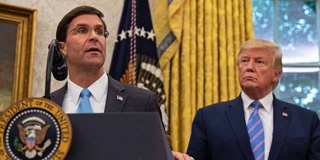 US Defense Secretary Mark Esper speaks after being sworn in while President Trump looks on in the Oval Office at the White House in Washington, DC, July 23, 2019. 