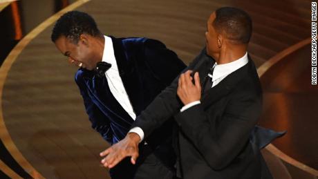 Will Smith and Chris Rock on stage at the Oscars.