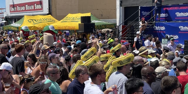 A crowd gathers to watch Nathan's Famous Hot Dog Eating Contest in Coney Island on July 4, 2022. 