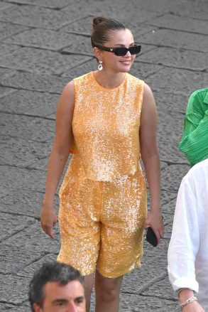 Capri, Italy.  Selena was spotted wearing her sequined dress as her friends walked into the Prada design store, where the somewhat elegant Italian-Canadian film producer Andrea Irvolino joined her in his suit jacket for Selena on a shopping spree.  * Filmed August 3, 2022 * Pictured: Selena Gomez Backgrid USA August 5, 2022 BYLINE MUST READ: COBRA TEAM / BACKGRID USA: +1 310798 9111 / usasales@backgrid.com UK: +44 208344 2007 / uksales @ backgrid.  com * UK Customers - Images containing children, please tag the face before posting *