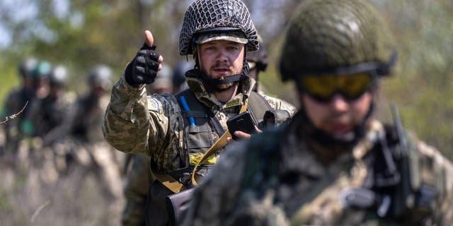 Dnipropetrovsk Oblast, Ukraine - May 9: Ukrainian infantrymen train on May 9, 2022 near Dnipropetrovsk Oblast, Ukraine.  Foot soldiers learn about survival scenarios when faced with the prospect of a Russian tank approaching at close range. 