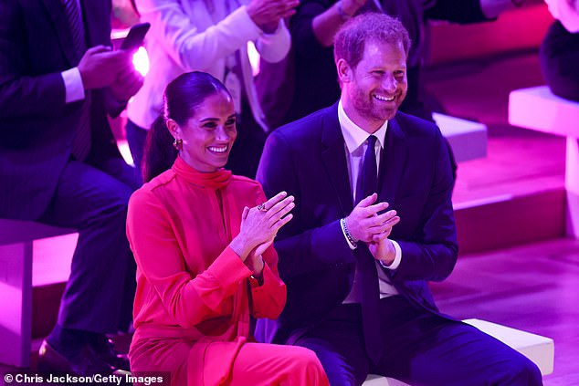 Meghan, Duchess of Sussex and Prince Harry, Duke of Sussex applaud during the opening ceremony of the One Young World Summit 2022 at Bridgewater Hall